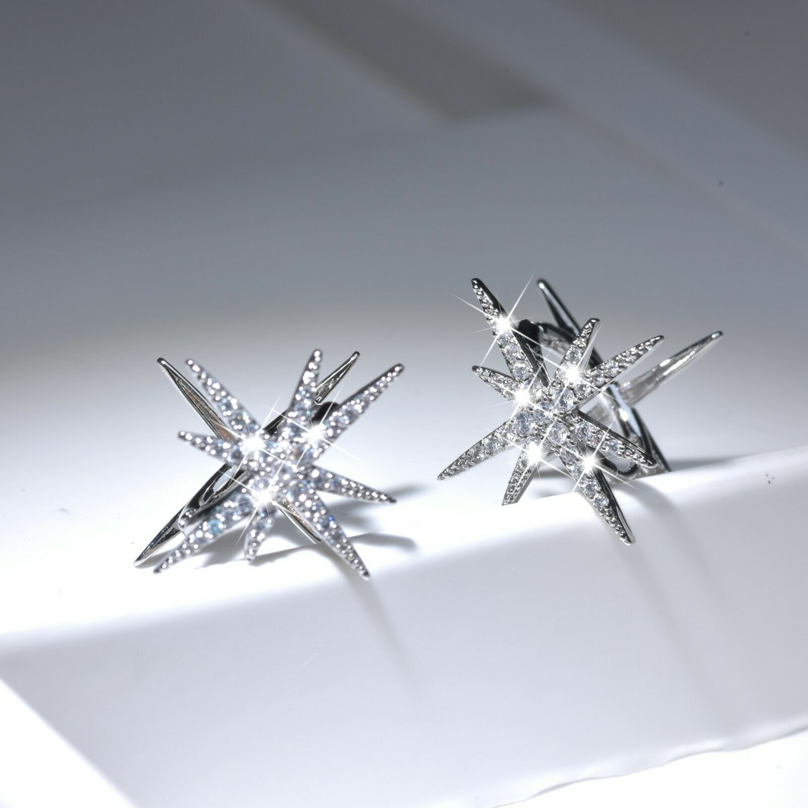 18k white gold plated made with SWAROVSKI crystal huggies Polaris north star earrings